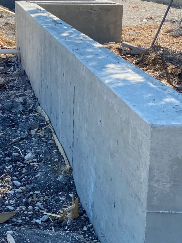 A retaining wall in a yard.